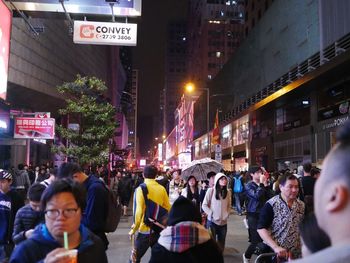 Crowd in city at night