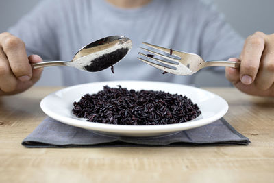 Midsection of person eating food