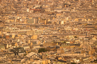 View of the city of paris with a high population density in summer