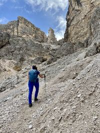 Rear view of man walking on mountain