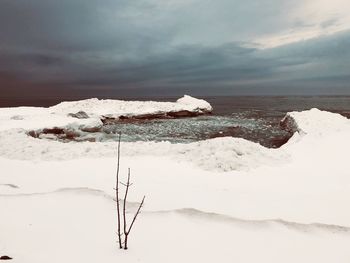 Scenic view of sea against sky during winter