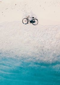 High angle view of bicycle by sea