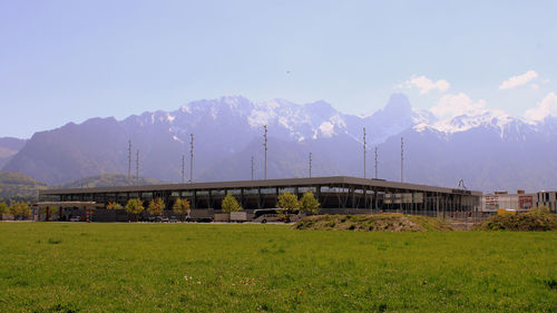 Built structure on field against sky