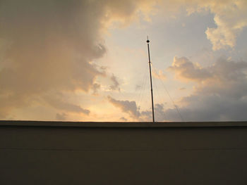 Low angle view of silhouette pole against sky during sunset