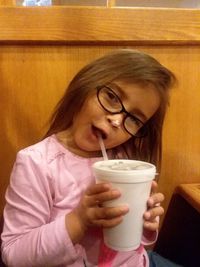 Portrait of woman drinking coffee