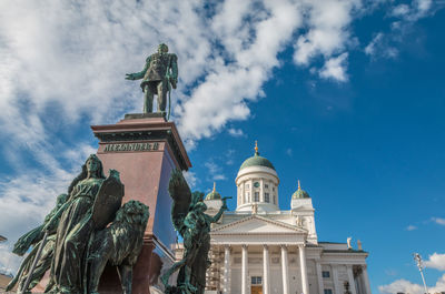 Low angle view of statue of building against sky