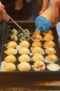 Takoyaki being prepared in ho thi ky street food, ho chi minh city