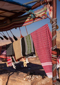 Low angle view of umbrellas hanging at market stall