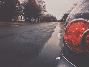 Cropped image of car parked by road