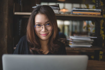 Close-up of young woman using smart phone