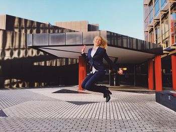 Woman on footpath in city