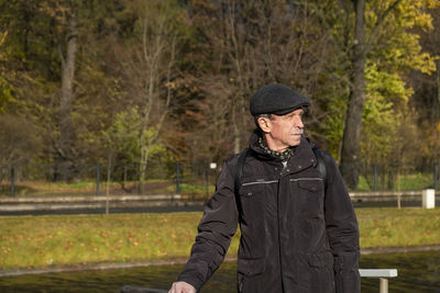 Portrait of man standing in forest