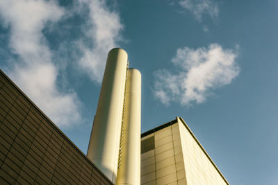 Low angle view of factory against sky