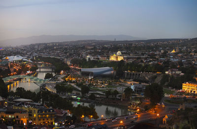 High angle view of illuminated buildings in city