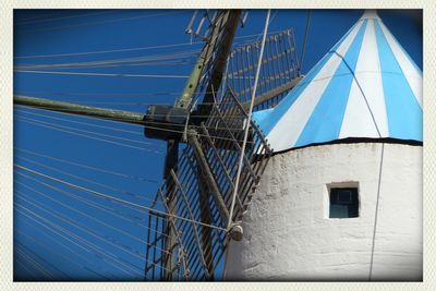 Low angle view of built structure against blue sky