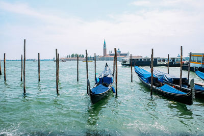 Boats moored in canal