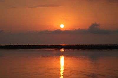 Scenic view of sea against romantic sky at sunset