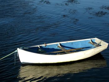 Close-up of boat moored in sea