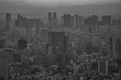 High angle view of buildings in city against sky