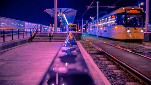 Train at railroad station at night