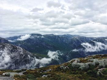 Scenic view of waterfall against sky