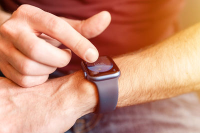 Male hand with a wrist smart apple watch. young man people using modern technology