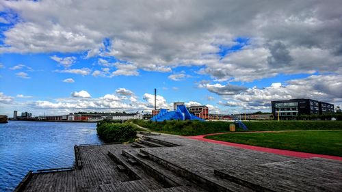 Scenic view of residential district against blue sky