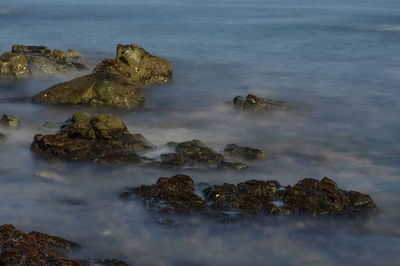 Scenic view of rocks in sea