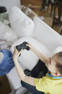 Boy using video game controller