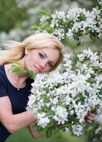 Portrait of young woman with flowers