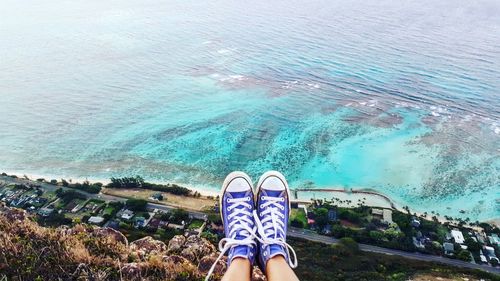 Low section of woman at deadmans catwalk over sea