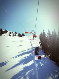 Ski lift over snow covered landscape