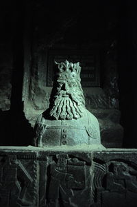 Statue of buddha against building