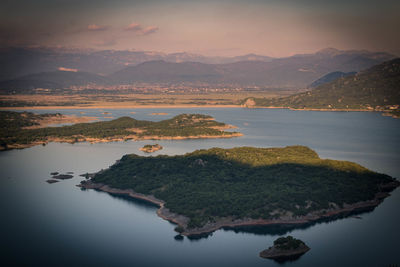 Scenic view of lake against sky during sunset