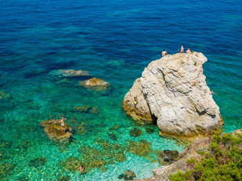 High angle view of rock formation in sea