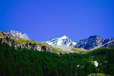 Scenic view of mountains against cloudy sky