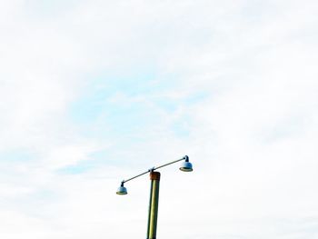 Low angle view of street light against sky