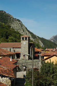 High angle view of building and mountains against sky