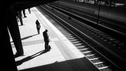 High angle view of people waiting on railroad platform