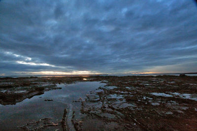 Scenic view of sea against sky at sunset