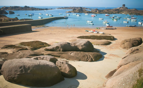 High angle view of rocks on beach against sky