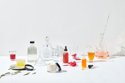 Apothecary of skincare ingredients and glassware