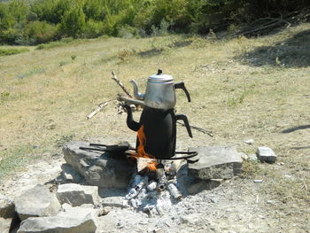 Tea kettle on stove at field