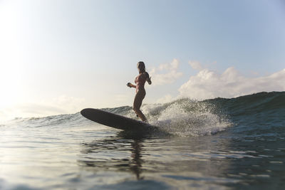 Female surfer in ocean