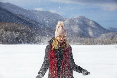 Portrait of young woman in snow