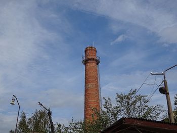 Low angle view of smoke stack against sky