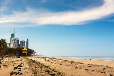 Lifeguard hut on shore against sky