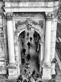 Tourists at entrance of historical building