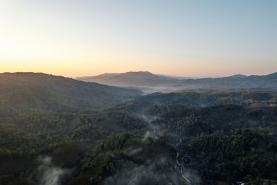 Scenic view of mountains against sky during sunset