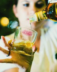 Close-up of woman holding drink